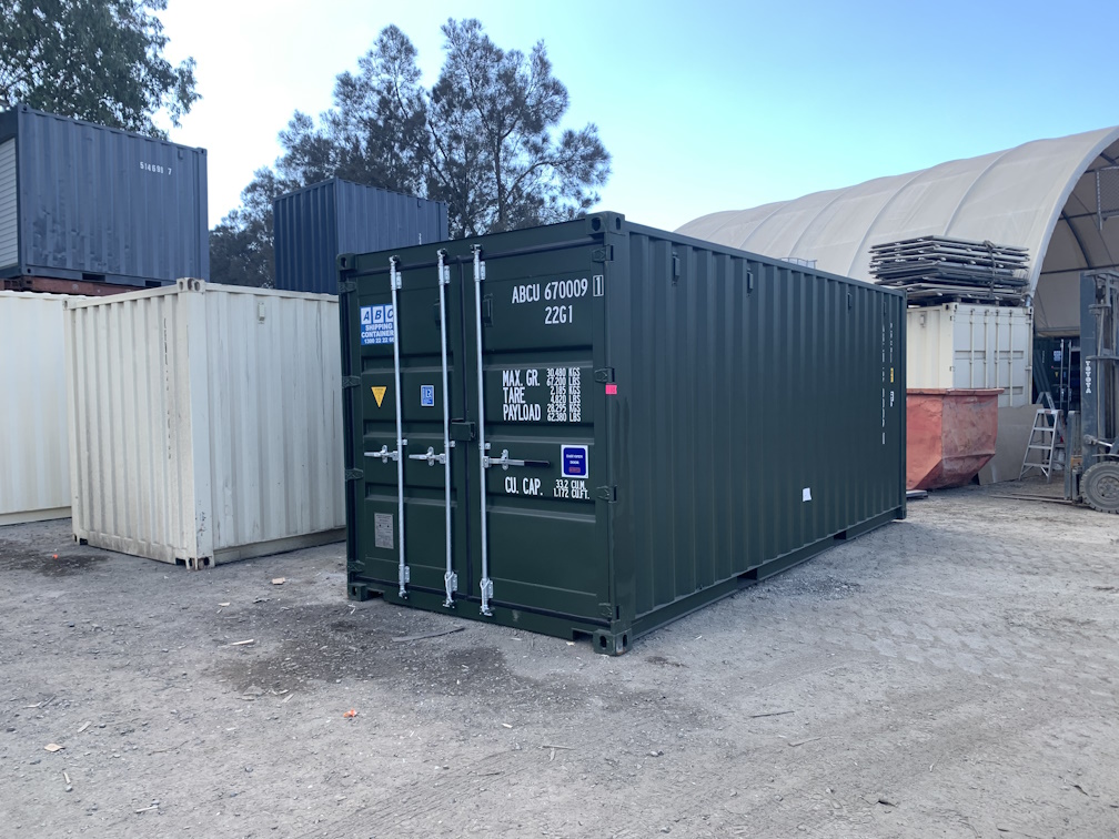 A dark coloured 20ft shipping container